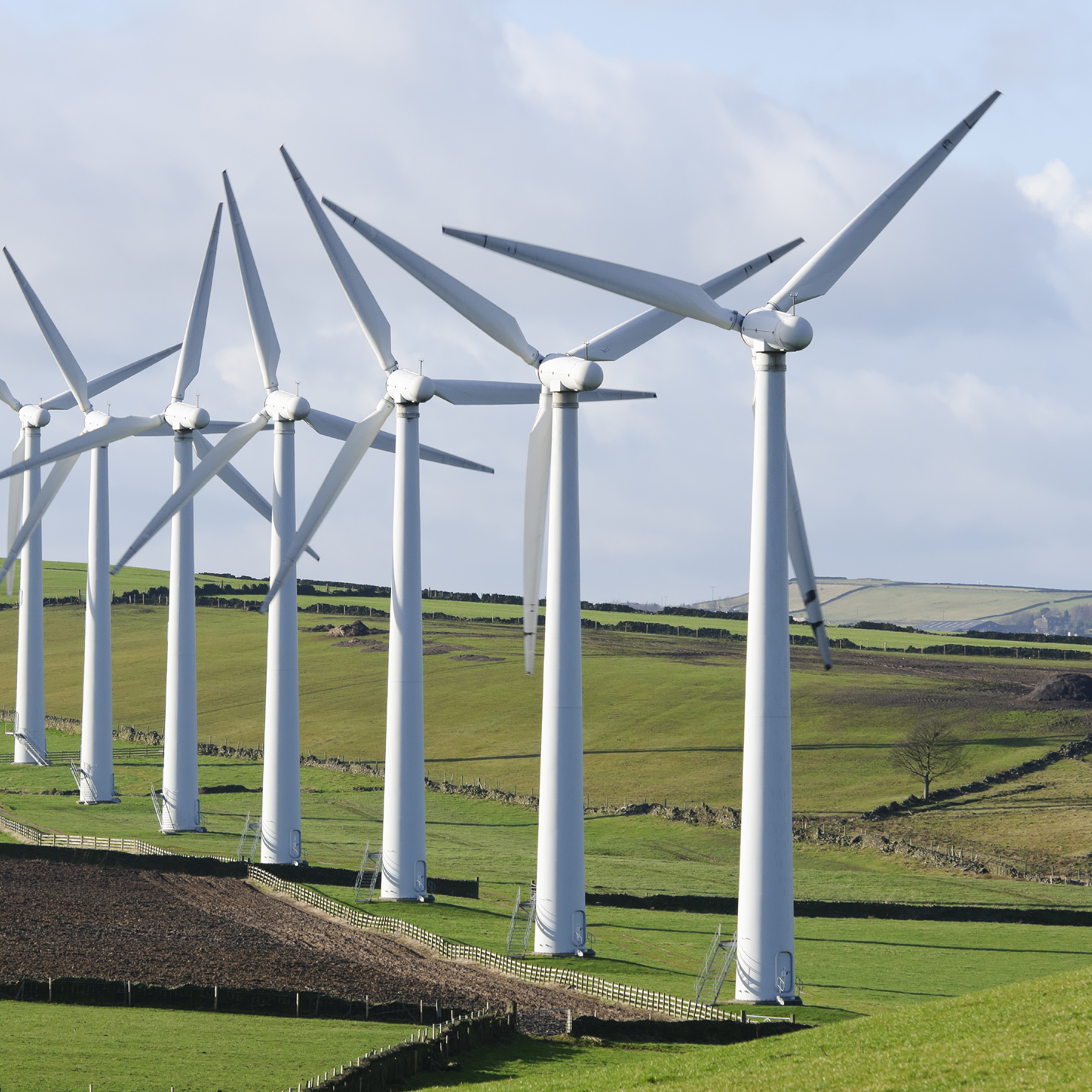 five wind turbines in countryside