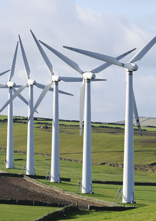 five wind turbines in countryside